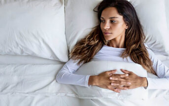woman in bed looking at empty space next to her because she's too picky in relationships