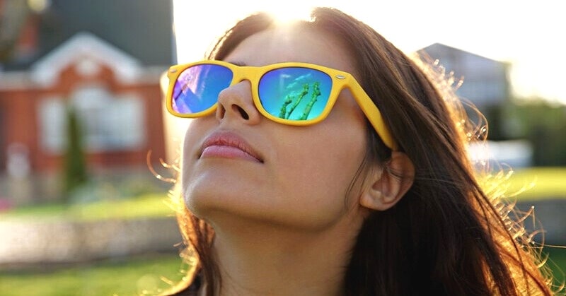woman wearing yellow sunglasses
