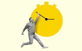 A man in grayscale appears joyful while holding one of the hands of a large, bright yellow stopwatch, which creates a playful and dynamic feel. The background is light yellow, accentuating the image's energetic and whimsical nature.