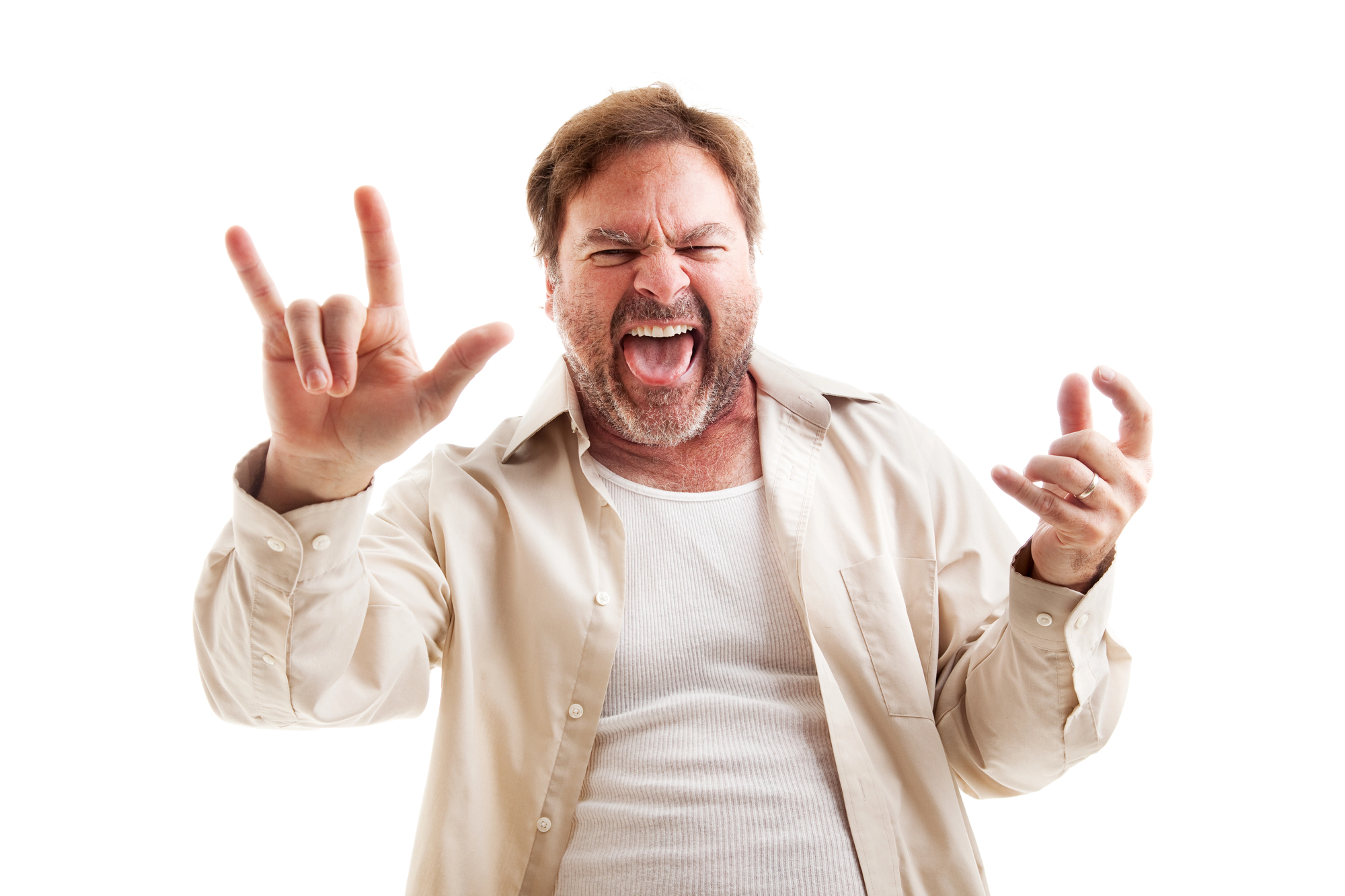 A man with a beard and mustache enthusiastically poses with a rock and roll hand gesture, sticking his tongue out. He is wearing a light-colored unbuttoned shirt over a white tank top, against a plain white background.